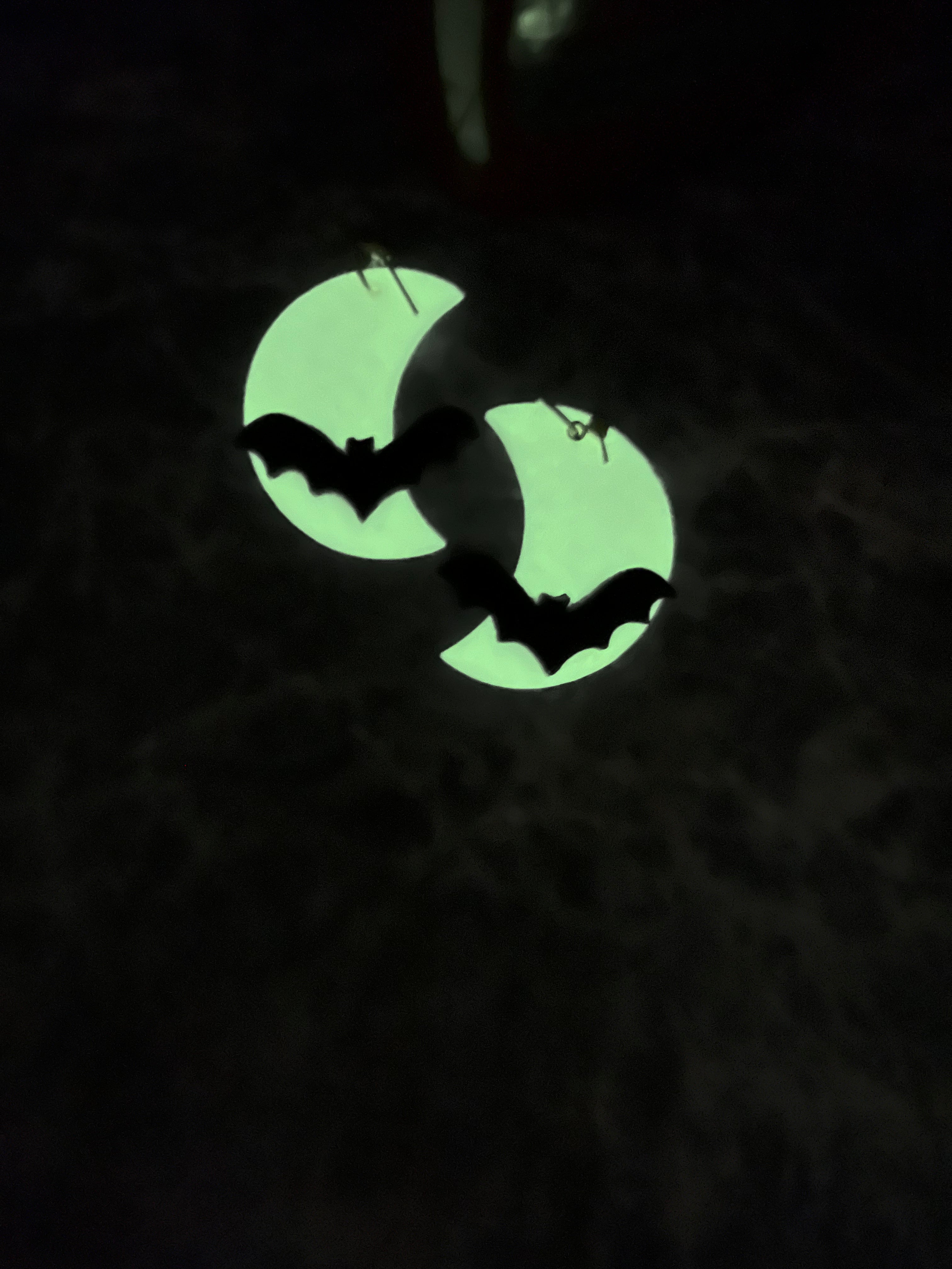 Crescent moon with bat